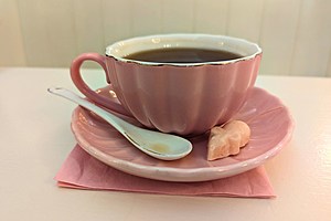 The shop's signature pink sugar mouse beside a cup of Earl Grey tea.  Credit: Phylicia Peterson