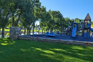 A photo of the Holliday Park playground with fence made from Castle Dare's walls. Credit: Phylicia Peterson, TSM SE Wyoming